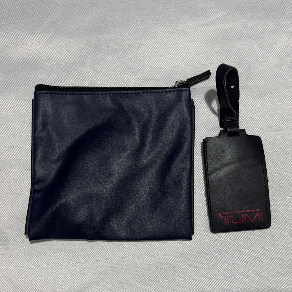 Tumi Navy Toiletry Bag with Black Leather Luggage Tag